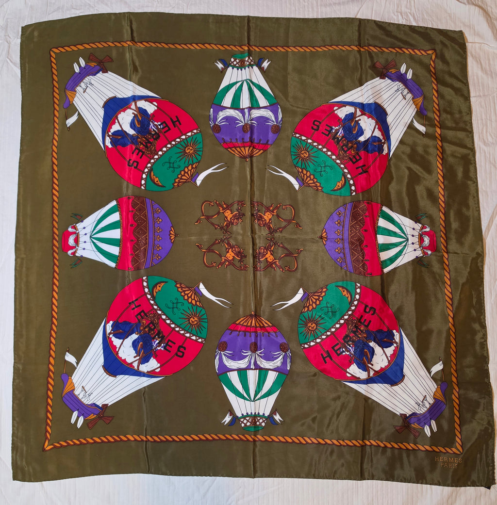 Hermès “Les Montgolfières” Silk Scarf – Olive Green – 90cm Carré – Mint Condition