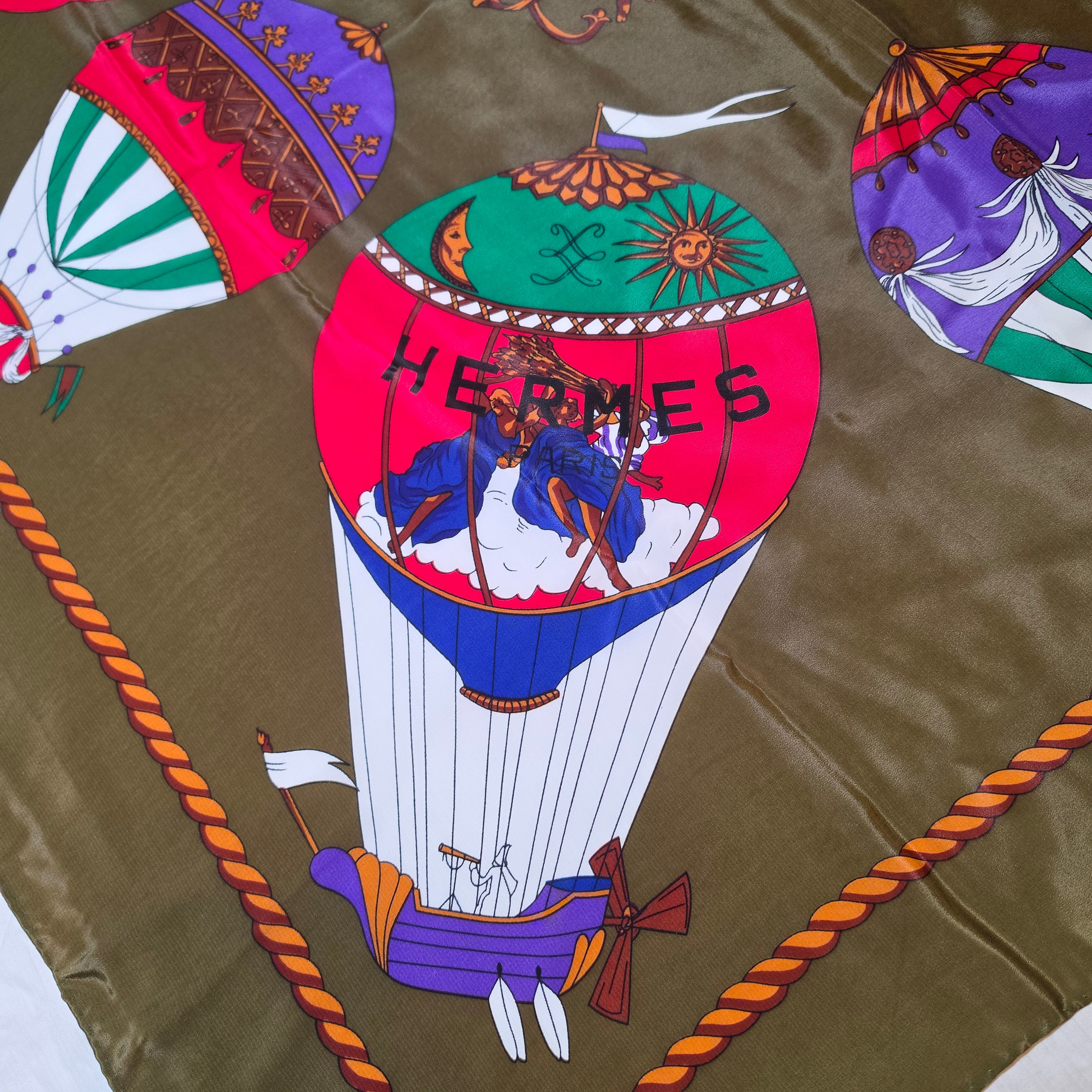 Hermès “Les Montgolfières” Silk Scarf – Olive Green – 90cm Carré – Mint Condition