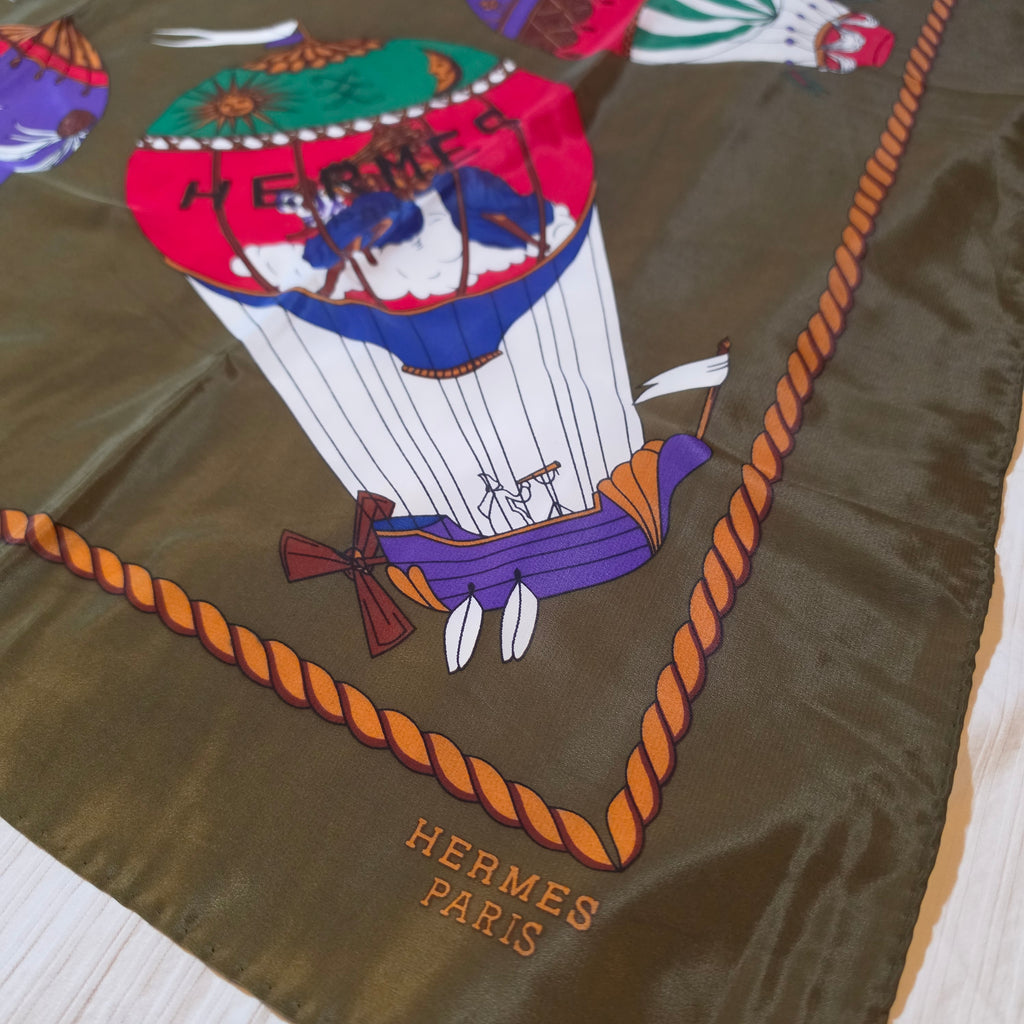 Hermès “Les Montgolfières” Silk Scarf – Olive Green – 90cm Carré – Mint Condition